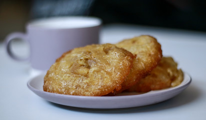 Bowsprit cake or kue cucur on white plate. Indonesian traditional cake.