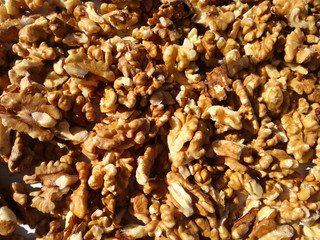 Group of nuts in the foreground. Dried fruits without skin. Natural peeled fruit. Walnut kernels skinless.