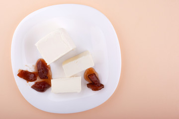 flat lay delicate homemade ice cream with pear jam on a white plate top view