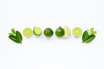 Fresh limes with leaves isolated on white