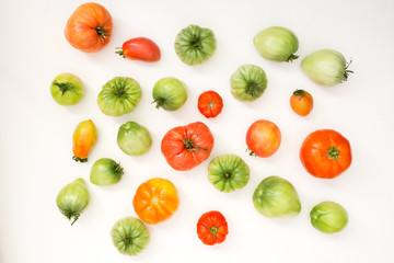 Summer harvest of vegetables concept. Set of green and red tomatoes.