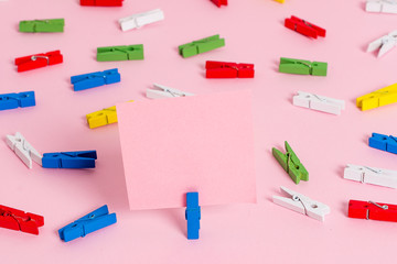 Colored clothespin papers empty reminder pink floor background office pin