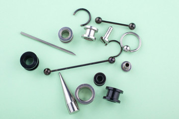 set of piercing accessories, earrings, tunnels, bars for stylish people