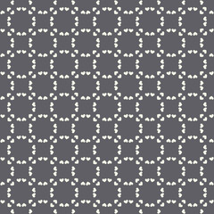 Geometric heart pattern black and white seamless pattern. A vector repeat design ideal for valentine projects.