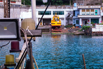 Fototapeta na wymiar Fish port in northern Taiwan, fishing port in Keelung Peace Island, shipyard near fishing port