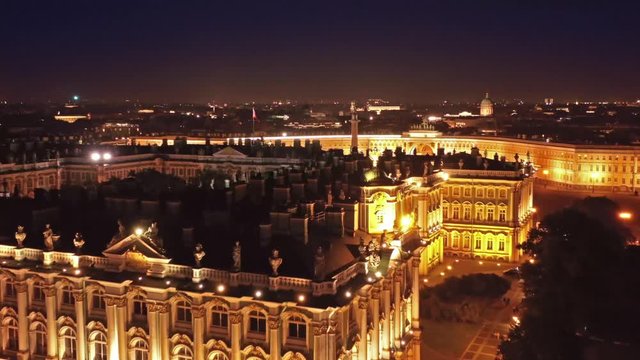Aerial view of the Winter Palace, the Alexander Column on Palace Square, and the General Staff Building in St. Petersburg at night, Russia, 4k