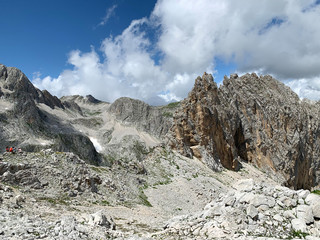 Tourists in the mountains of Abkhazia in summer in sunny day