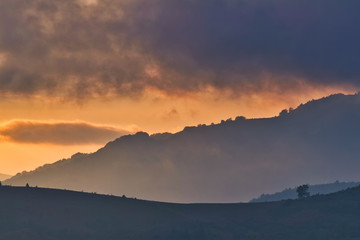 Fototapeta premium Magestic sunset in the carpatian mountains. Natural autumn landscape.
