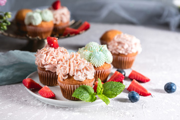 Homemade tasty cupcakes with fresh berries