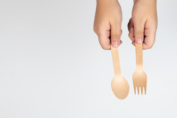 Top view boy hand hold the kitchenware, spoon and fork