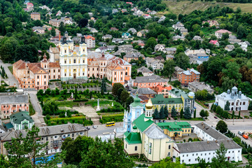 Fototapeta na wymiar Aerial view to historical center of town Kremenets, Ternopil region, Ukraine. August 2019 Jesuit Collegium in center.