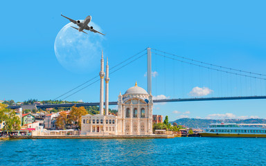 Fototapeta na wymiar Airplane flying over Ortakoy Mosque with full moon - Istanbul, Turkey 