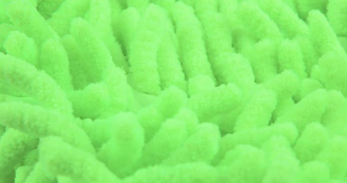 The texture of the fabric. Green knitted texture