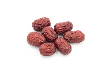Close-up of a small pile of Chinese red dates on a white background
