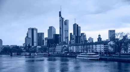 Fototapeta premium Skyline over the Main River at sunset - Frankfurt is the financial center of the country, Germany