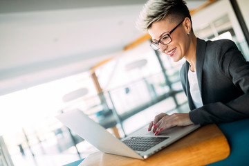 Portrait of businesswoman working on computer in office