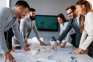 Group of architects and business people working together and brainstorming