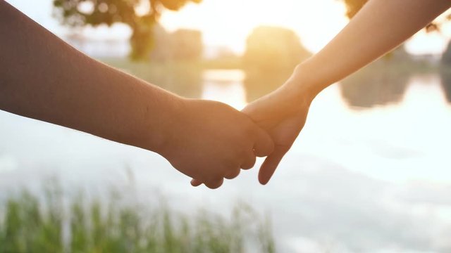 The guy and the girl hold out their hands to each other and part.