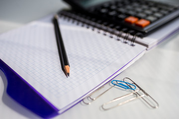 notebook and pen on the table