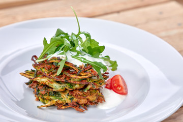 zucchini pancakes with sour cream and herbs