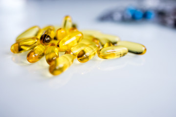 fish oil capsules on white background