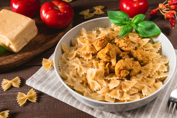 Farfalle pasta with chicken and cheese © anitty