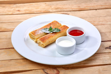 pancakes with sour cream and berry sauce