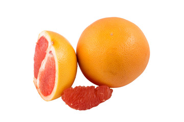 whole grapefruit and slices on a white background in isolation