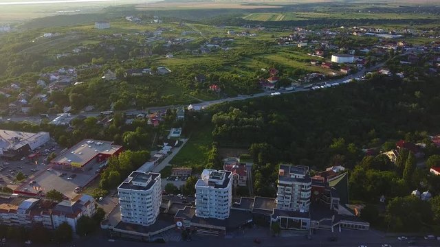 Aerial view of Slatina city and river Olt, Romania. Drone flight over the european city in summer day.