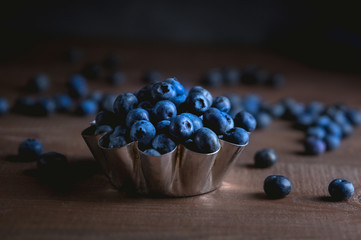Closeup view of fresh blueberry on black background