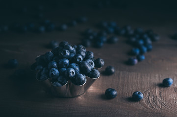 Closeup view of fresh blueberry on black background