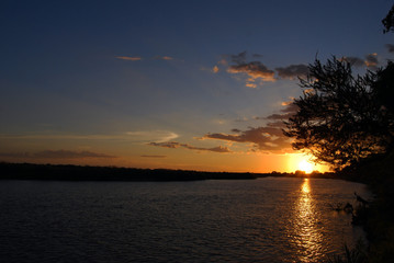 Fototapeta na wymiar Sunset over the Rufiji River in the Selous Game Reserve, Tanzania