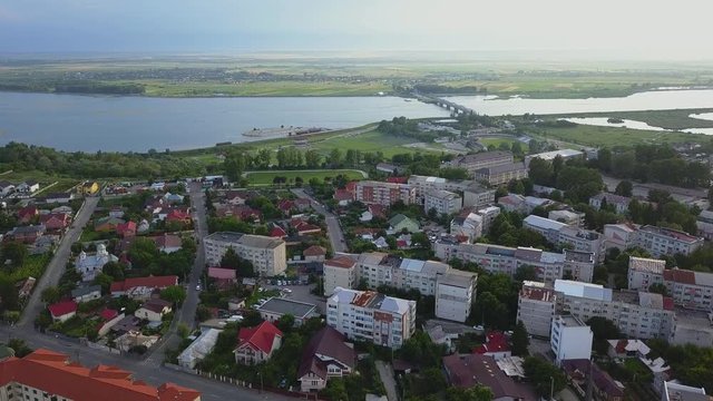 Aerial view of Slatina city and river Olt, Romania. Drone flight over the european city in summer day.