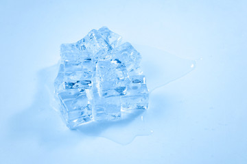 Obraz premium Ice crystal cubes, space for text or design.
