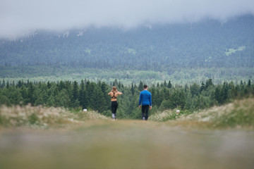 Fototapeta na wymiar Man and woman jogging together outdoor
