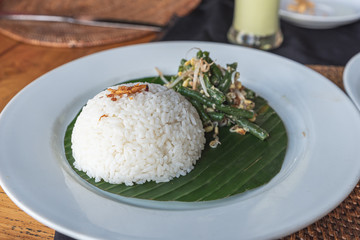 plain rice dish and string beans in a bali restaurant
