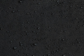 dark gray waterproof hydrophobic flat cloth closeup with rain drops background - obrazy, fototapety, plakaty