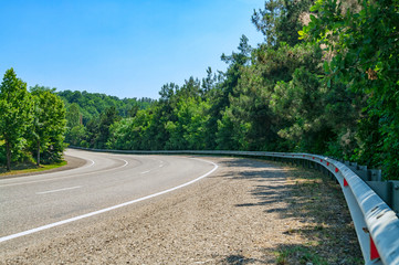 Empty modern asphalt road in summer.