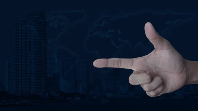 email flat icon on finger over modern city tower and skyscraper with world map, Business contact us concept, Elements of this image furnished by NASA