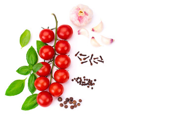Top view of red ​​tomato cherry with green basil leaves and young garlic, spice, isolated on white background, Flat lay.