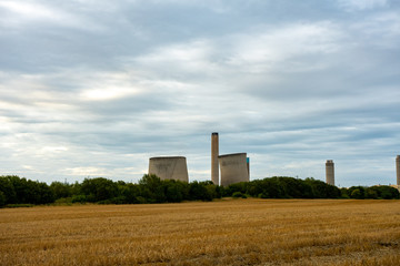 Fototapeta na wymiar Didcot inactive power plant cooling towers early state of collapse during demolition at 18th of August 2019
