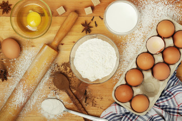 Food ingredients for baking: flour, eggs, milk, sugar