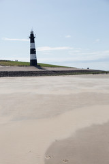 Leuchtturm am Sandstrand