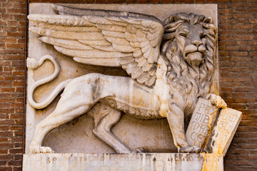 Venetian lion on the wall of old house at Piazza delle Erbe in Verona, Italy