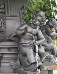 Fototapeta na wymiar Sculptures at the fountain at the new castle of Stuttgart