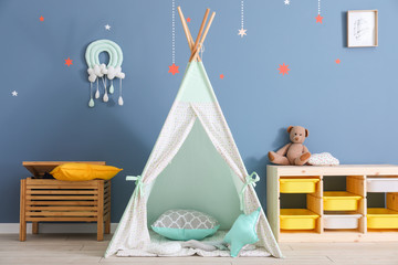 Interior of modern children's room with teepee
