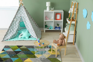 Interior of modern children's room with teepee