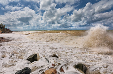 Dramatic clouds, big waves splash and foam. Storm on the west coast of Crimea. Black Sea