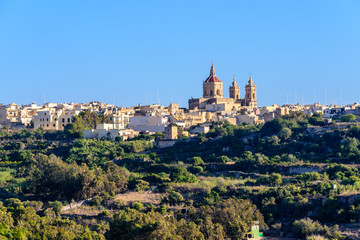 Fototapeta na wymiar Xaghra Parish Church which dominates the Gozo town of Xaghra.