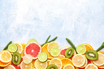 Different fresh fruits on color background